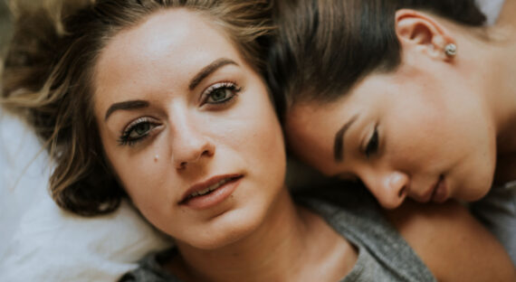 lesbian-couple-together-in-bed-HFYEQ9X.jpg